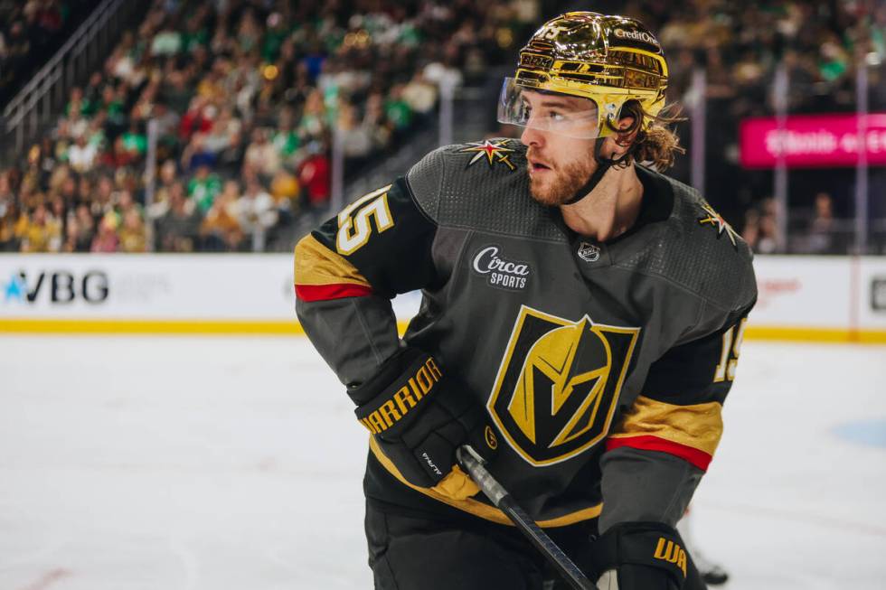 Golden Knights defenseman Noah Hanifin (15) watches for the puck during an NHL game between the ...