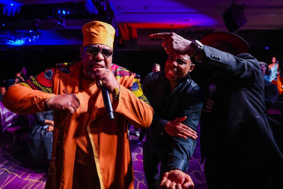 Kool Moe Dee, left, performs as Doug E. Fresh, middle, and Grandmaster Caz cheer him on during ...