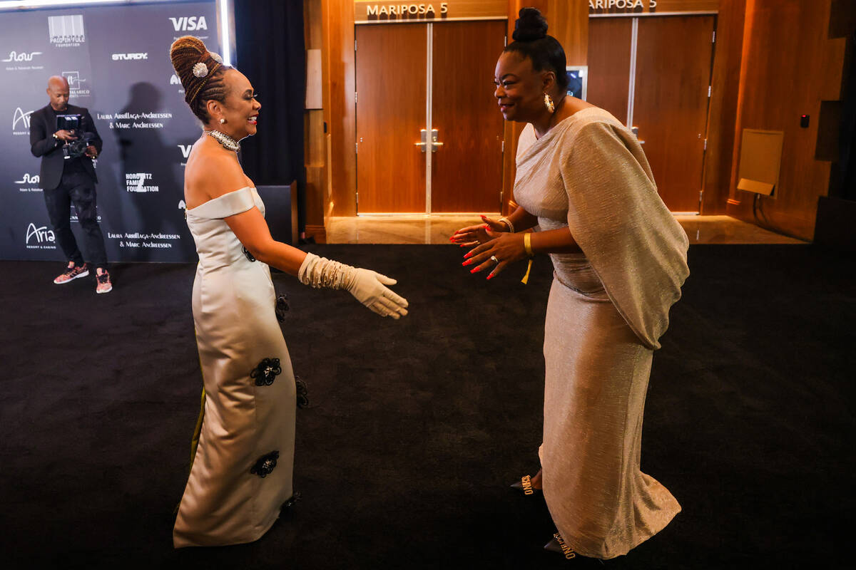 Felicia Horowitz, president of the Paid in Full Foundation, left, greets Roxanne Shonte during ...