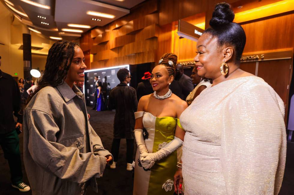 Samara Cyn, left, converses with Roxanne Shante, right, during the Paid in Full Foundation&#x20 ...