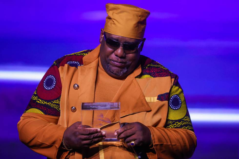 Kool Moe Dee looks down at his award during the Paid in Full Foundation’s Hip Hop Grandm ...