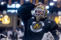 Golden Knights goaltender Adin Hill (33) adjusts his helmet during the first day of training ca ...