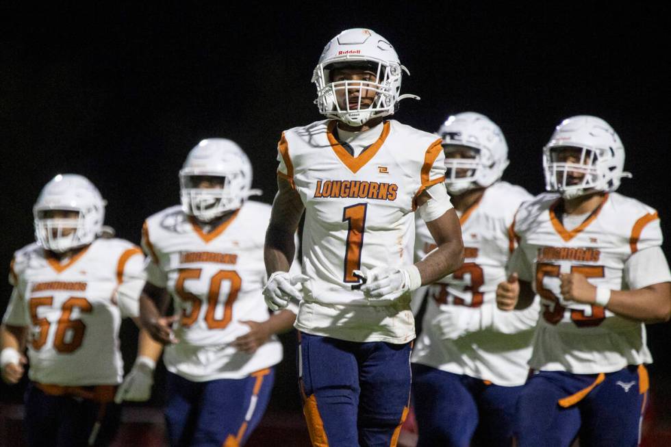 Legacy senior Dominic Oliver (1) leaves the huddle during the Class 5A high school ‘Batt ...