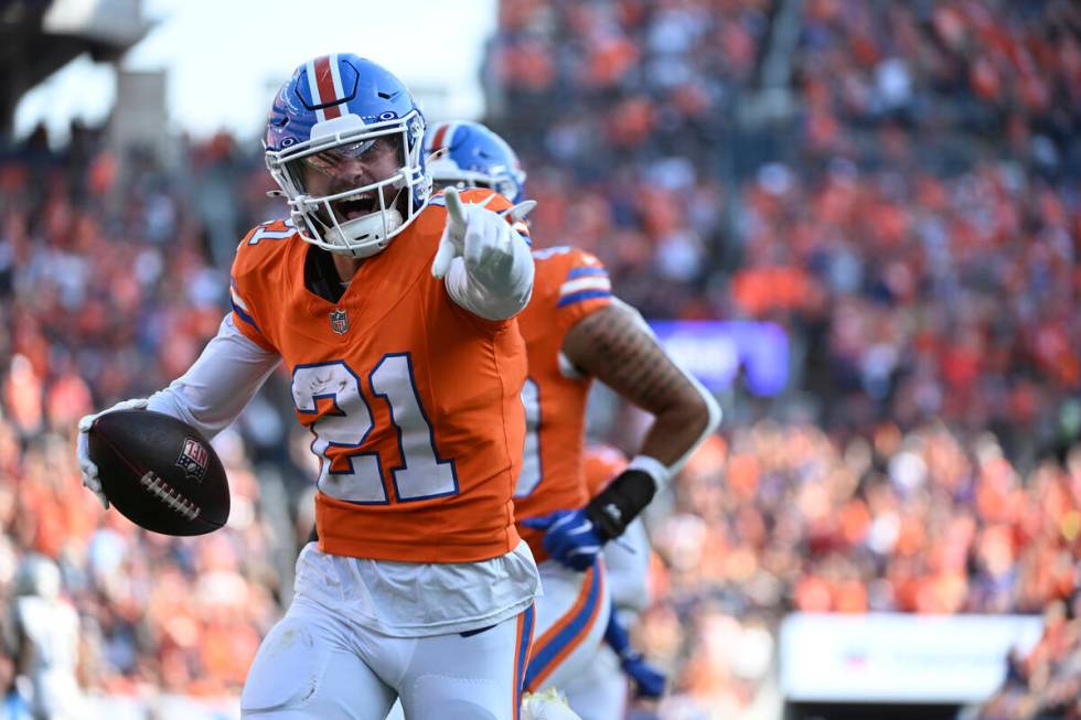 Denver Broncos cornerback Riley Moss (21) reacts after his interception intended for Las Vegas ...