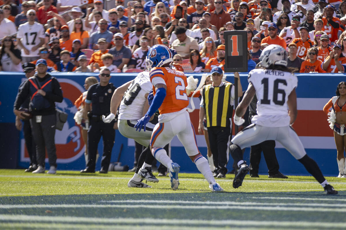 Denver Broncos cornerback Pat Surtain II (2) intercepts a pass intended for Raiders tight end B ...