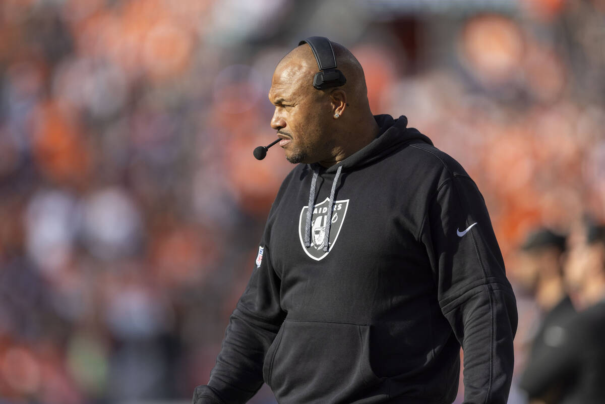 Raiders head coach watches the team play from the sideline during the second half of an NFL gam ...