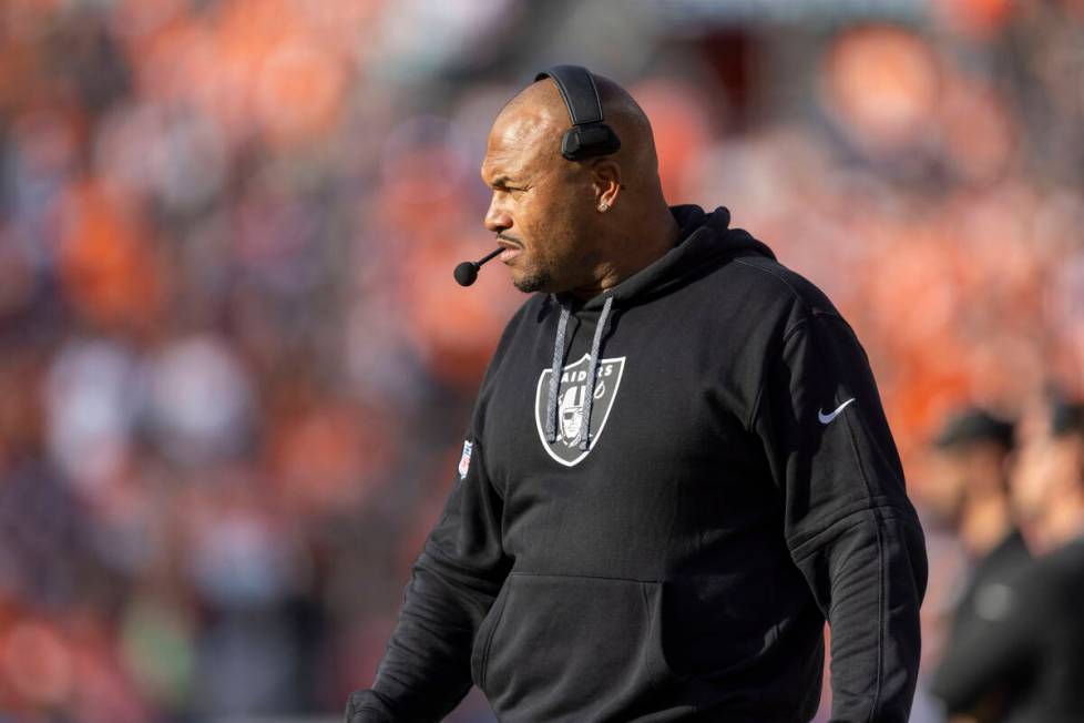 Raiders head coach watches the team play from the sideline during the second half of an NFL gam ...