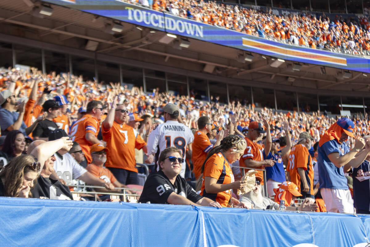 A Raiders fan looks on after a Denver Broncos touchdown during the second half of an NFL game a ...