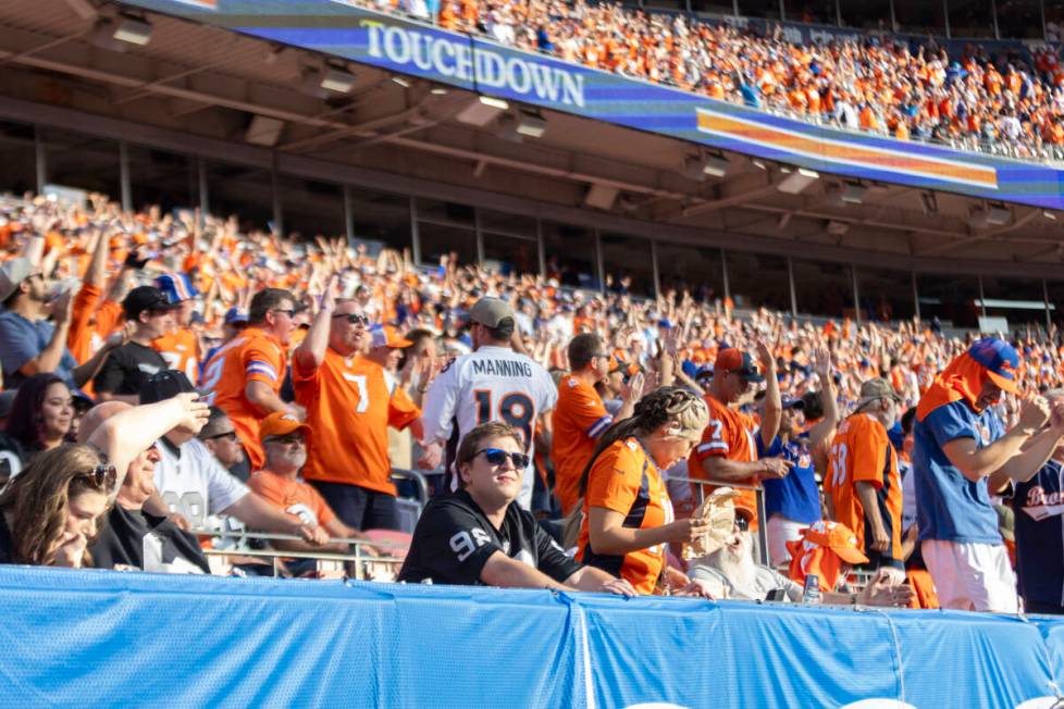 A Raiders fan looks on after a Denver Broncos touchdown during the second half of an NFL game a ...