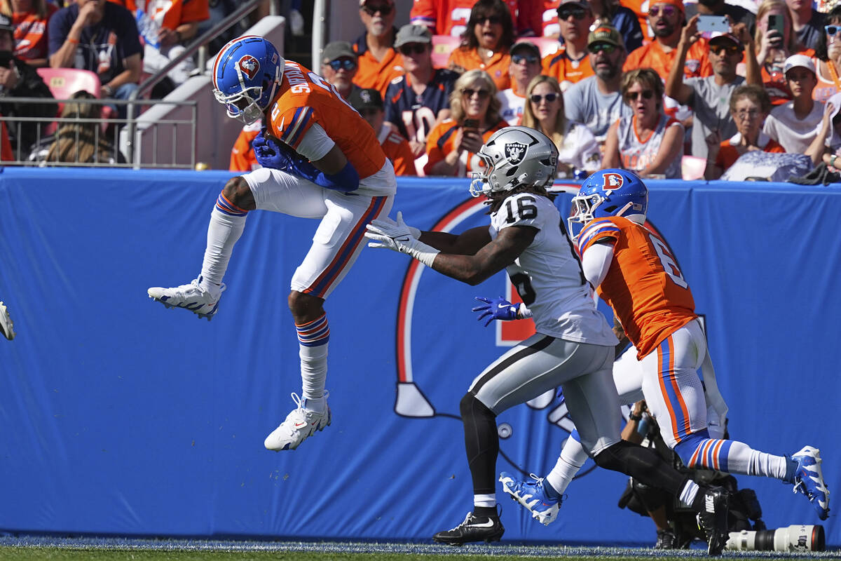 Denver Broncos cornerback Pat Surtain II (2) returns an interception for 100 yards against the ...