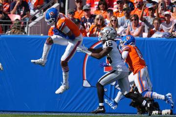 Denver Broncos cornerback Pat Surtain II (2) returns an interception for 100 yards against the ...