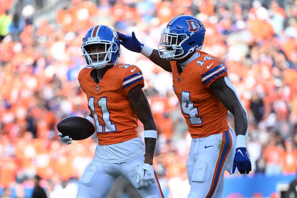 Denver Broncos wide receiver Josh Reynolds (11) celebrates his 9-yard reception for a touchdown ...