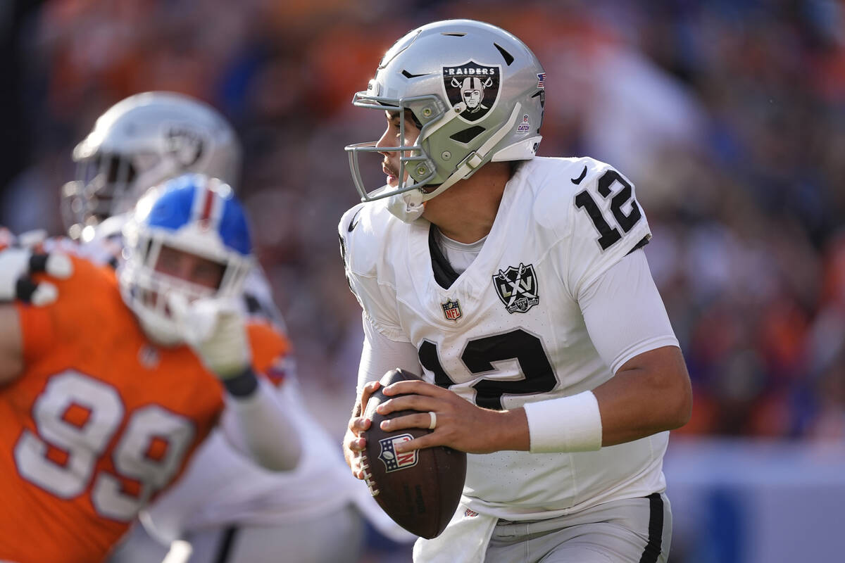 Las Vegas Raiders quarterback Aidan O'Connell looks downfield during the second half of an NFL ...