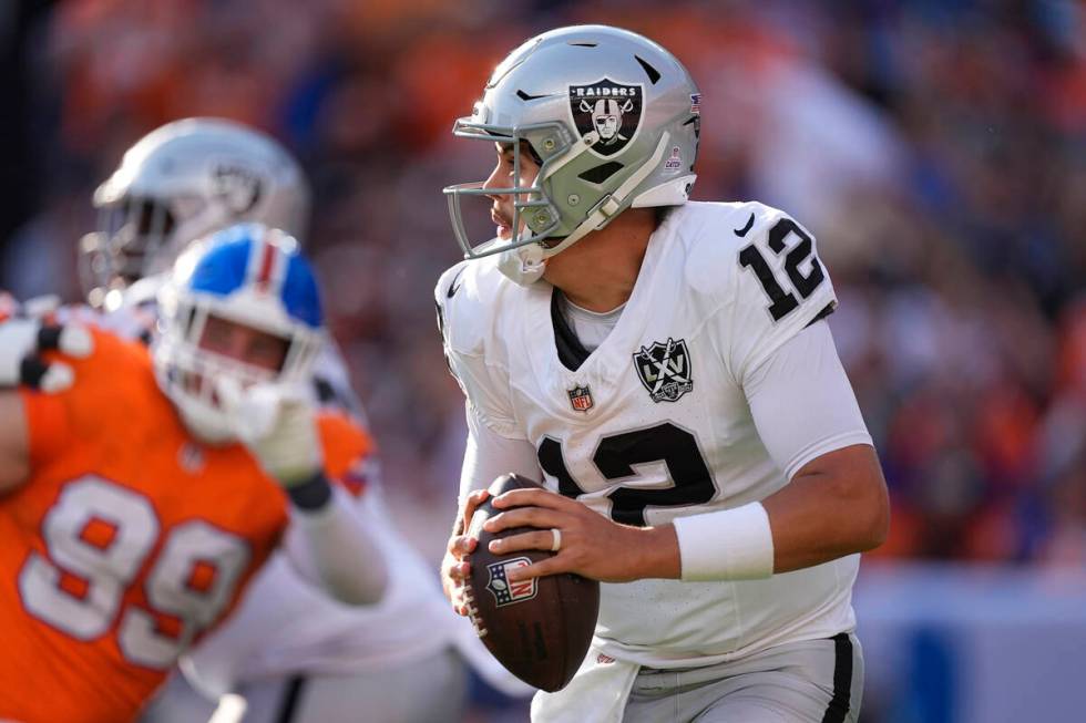 Las Vegas Raiders quarterback Aidan O'Connell looks downfield during the second half of an NFL ...