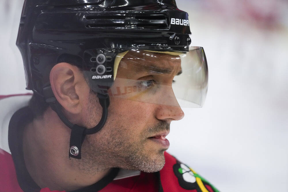 Chicago Blackhawks defenseman Alec Martinez warms up before an NHL hockey game against the Detr ...