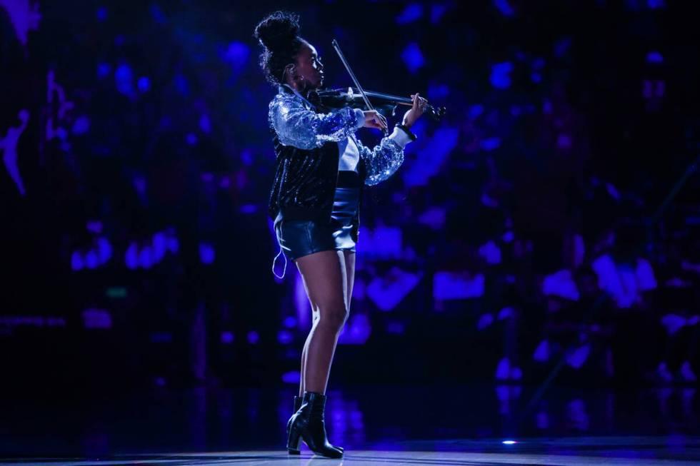 Violinist Bri Blvck performs during game four of a WNBA semifinals playoff series between the A ...