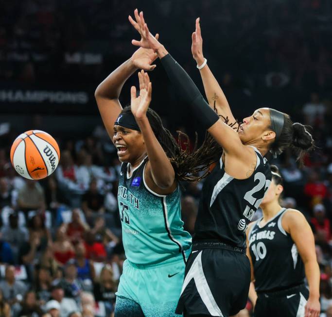 New York Liberty forward Jonquel Jones (35) loses her grip on the ball while Aces center A'ja W ...