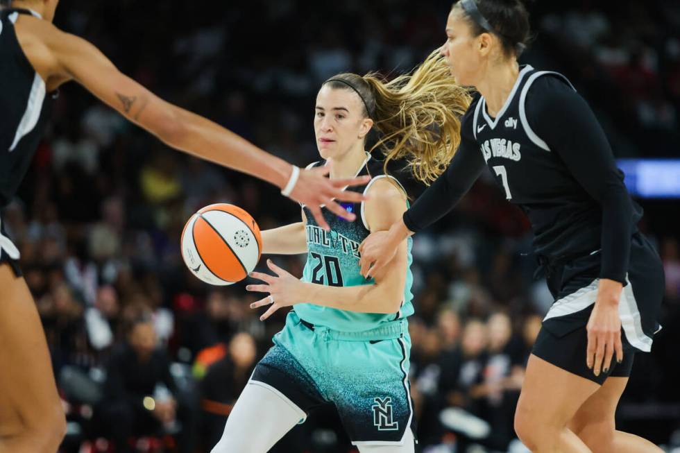 New York Liberty guard Sabrina Ionescu (20) dribbles the ball through Aces defense during game ...