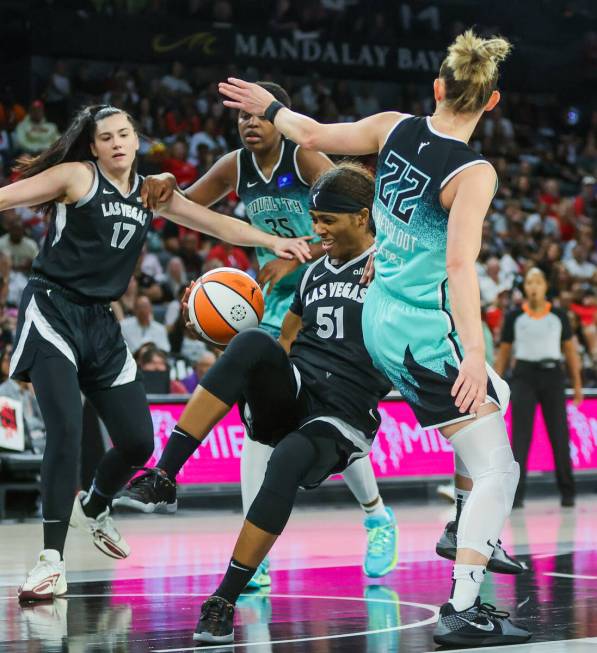 Aces guard Sydney Colson (51) loses her balance during game four of a WNBA semifinals playoff s ...