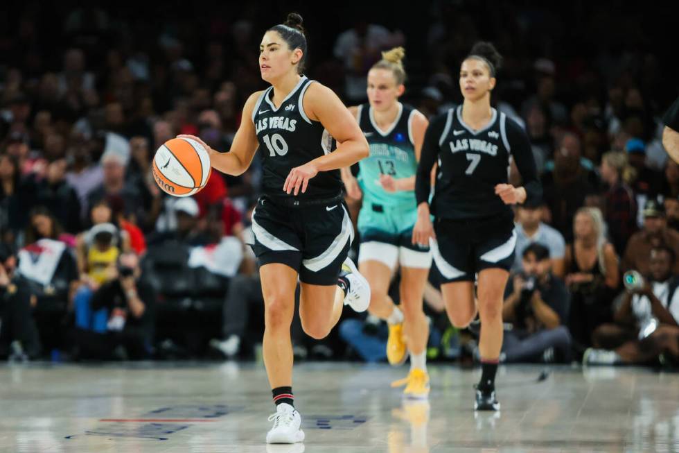 Aces guard Kelsey Plum (10) dribbles the ball down the court during game four of a WNBA semifin ...