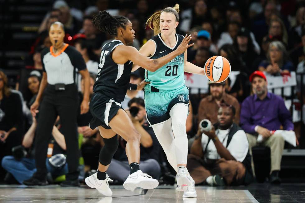 New York Liberty guard Sabrina Ionescu (20) keeps the ball away from Aces guard Tiffany Hayes ( ...