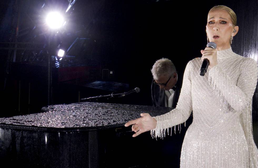 This photo released by the Olympic Broadcasting Services shows Canadian Singer Celine Dion perf ...