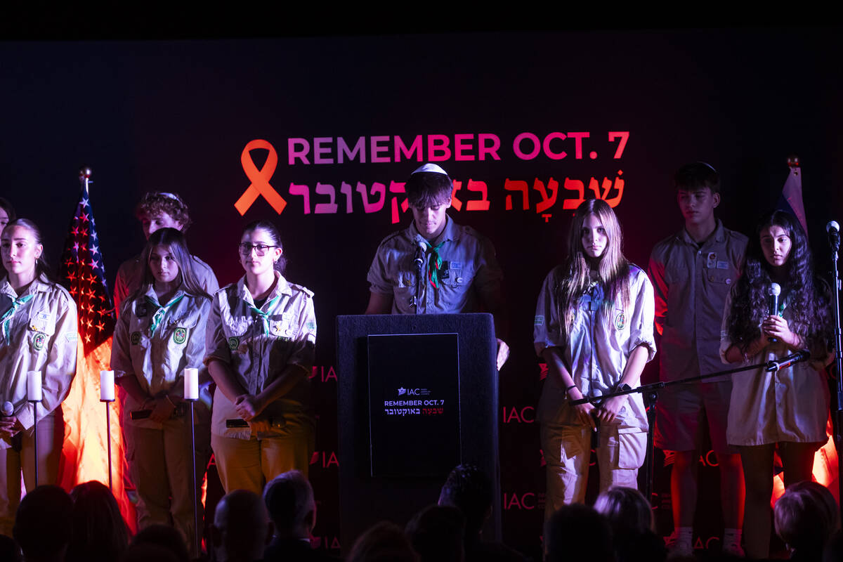 People sing during an event marking one year since the Oct. 7 terrorist attacks on Israel at La ...