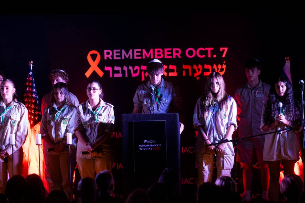 People sing during an event marking one year since the Oct. 7 terrorist attacks on Israel at La ...