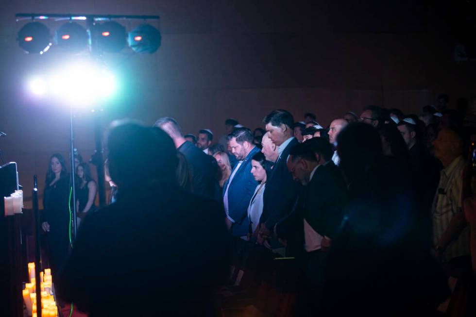 People, including Republican senatorial candidate Sam Brown, listen during an event marking one ...