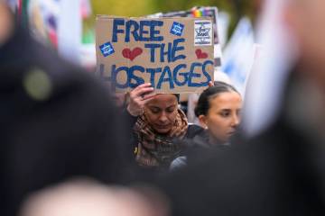 People attend a demonstration in support of Israel to mark the first anniversary of the Hamas a ...