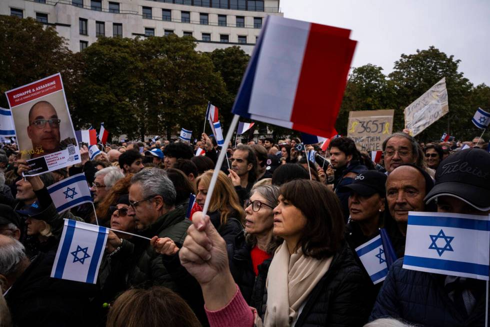 People attend a demonstration in support of Israel to mark the first anniversary of the Hamas a ...