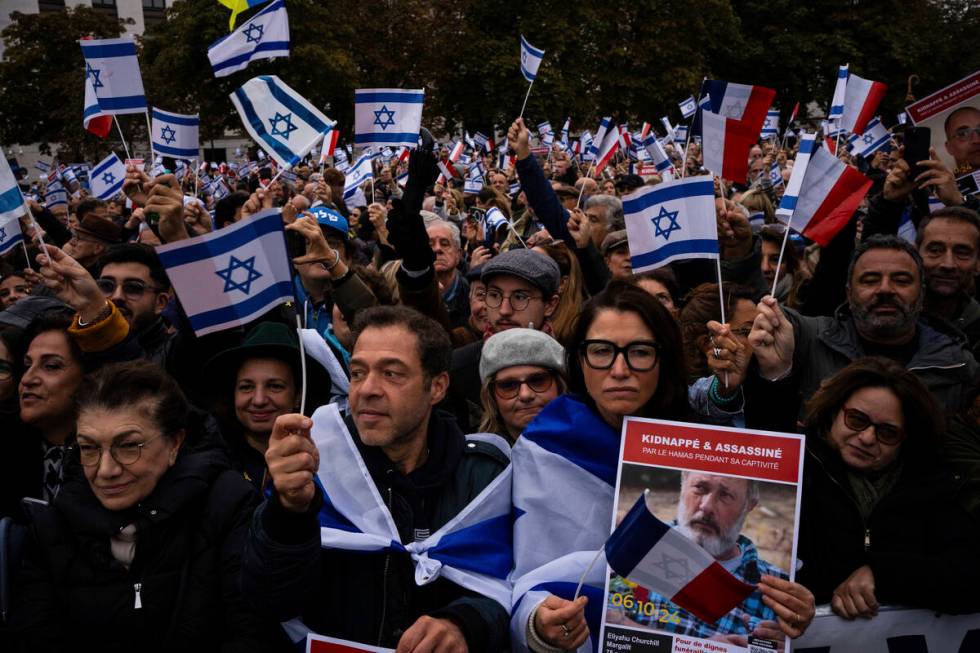 People attend a demonstration in support of Israel to mark the first anniversary of the Hamas a ...