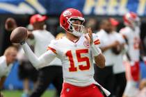 Kansas City Chiefs quarterback Patrick Mahomes throws during warm ups before an NFL football ga ...