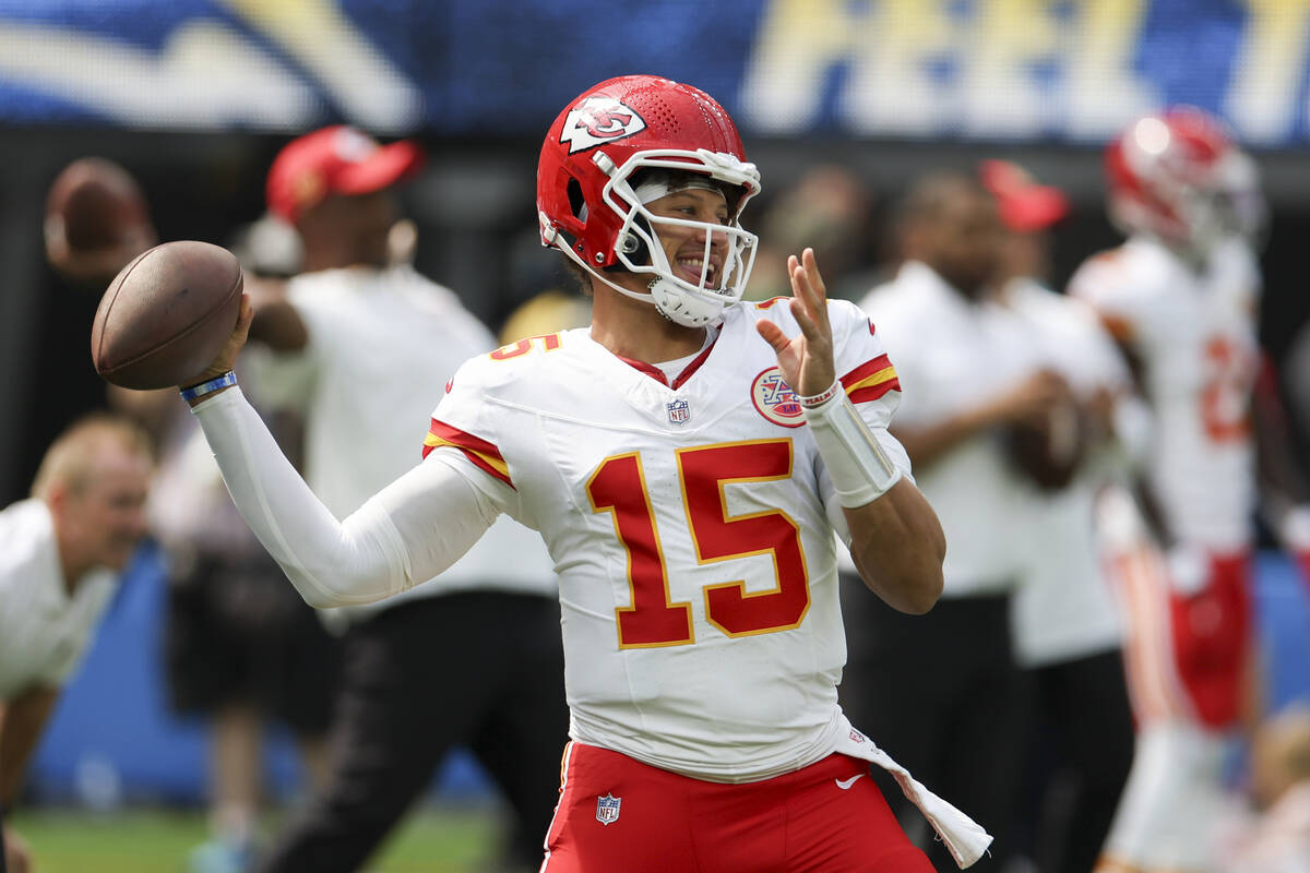 Kansas City Chiefs quarterback Patrick Mahomes throws during warm ups before an NFL football ga ...