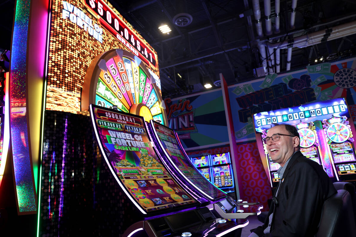 Mr. Khin, IGT President, Global Gaming, shows the Wheel of Fortune Cash Link Big Money during a ...