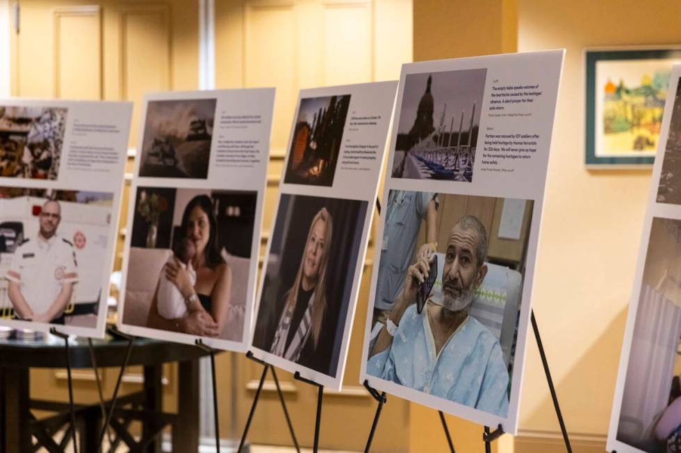 Images of hostages captured by Hamas are seen on display during a ceremony at Midbar Kodesh Tem ...