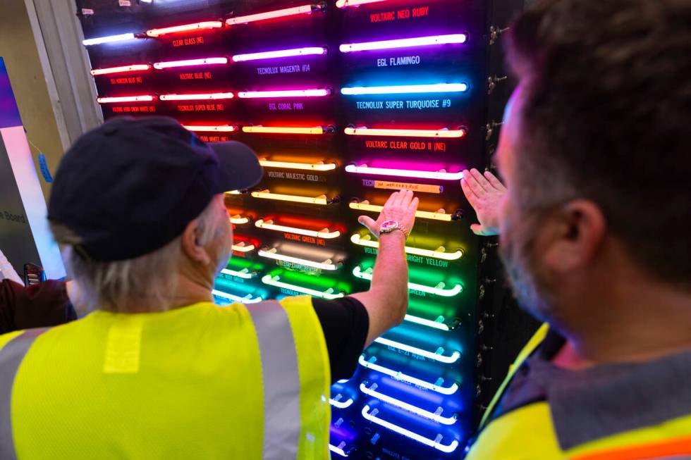 Todd Fisher, left, takes a look at the different neon and argon colors on Wednesday, Sept. 11, ...