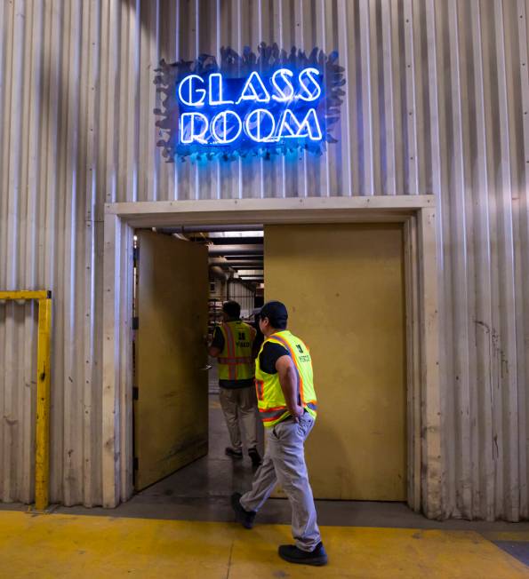 YESCO neon bender Oscar Gonzalez walks into the glass room to work on neon tubes for the renova ...