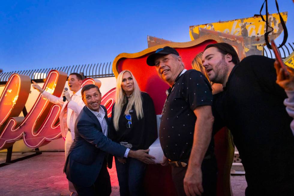 The Neon Museum executive director Aaron Berger, left, counts down as, from left, Jeff Young, e ...