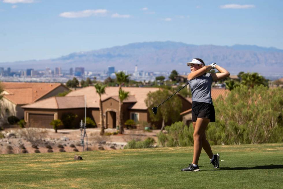 Faith Lutheran’s Maddie Perez drives her ball down to hole 11 during the 5A Desert Leagu ...