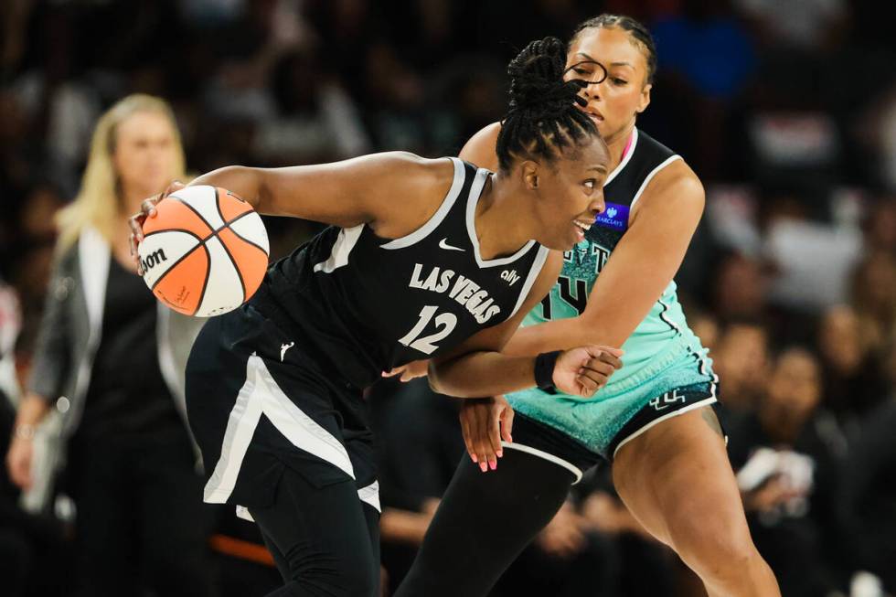 Aces guard Chelsea Gray (12) looks for an open teammate as New York Liberty forward Betnijah La ...