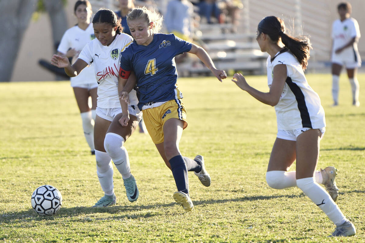 Making her way past the defense, senior Makayla Nelson (4) maneuvers downfield against SLAM Aca ...