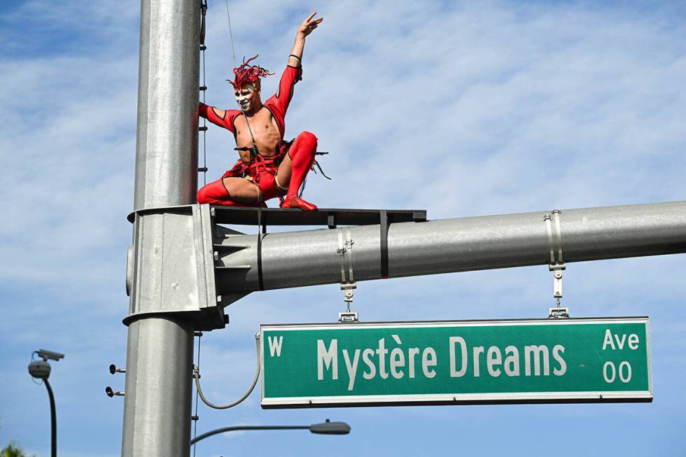 Mystère’s Red Bird perches on top of the “Mystère Dreams Ave” sign along the Las Vegas ...