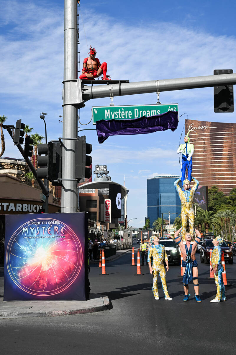 Cirque du Soleil performers for "Mystère" unveil the Mystère Dreams Ave sign on the Las Vegas ...