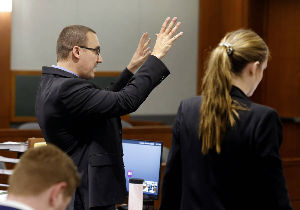 Prosecutor Kennedy Holthus, right, listens as Attorney Ryan Helmick, representing Serge Kamga, ...