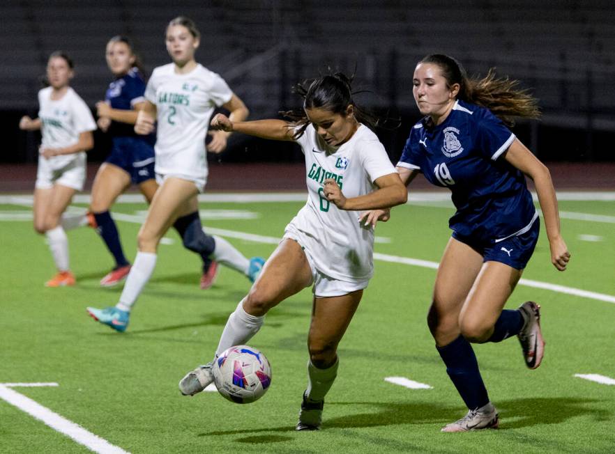 Green Valley junior Shealyn Pease (6) and Centennial midfielder Karly Kramer (19) compete for t ...