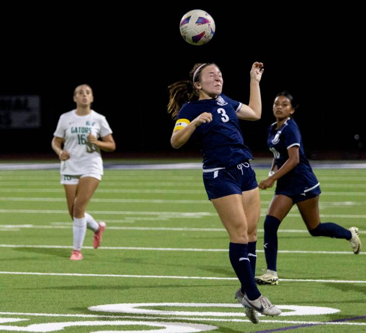 Centennial forward Natalie Sligar (3) jumps for the ball during the high school soccer game aga ...