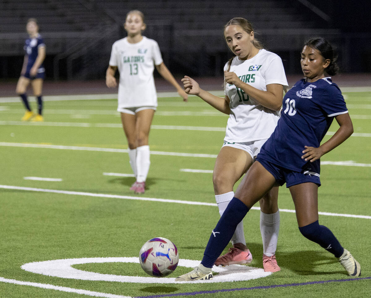 Centennial midfielder Alexandra Miranda (10) and Green Valley junior Peyton Vaughn (16) compete ...