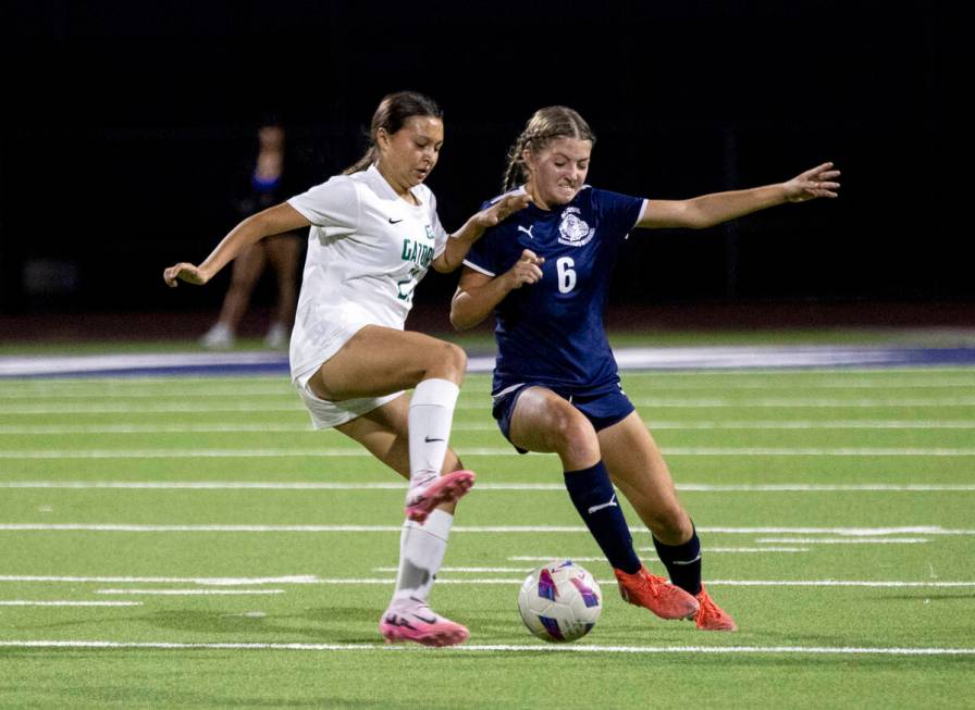 Green Valley forward Aleah Klein (21) and Centennial senior Ellah Scharringhausen (6) compete f ...