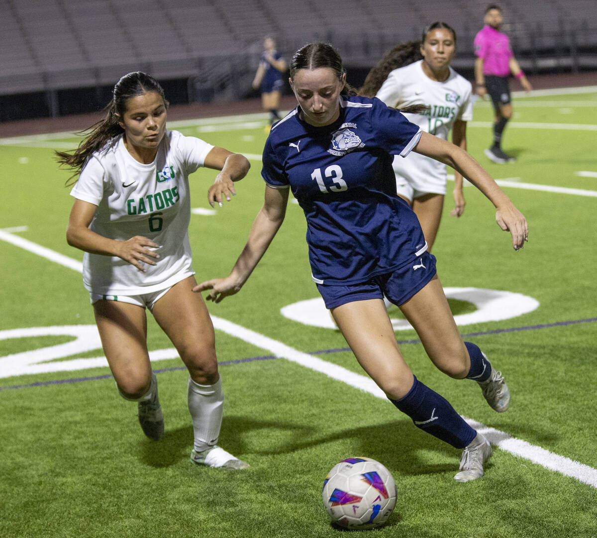 Green Valley junior Shealyn Pease (6) and Centennial defender Ella Davis (13) compete for the b ...